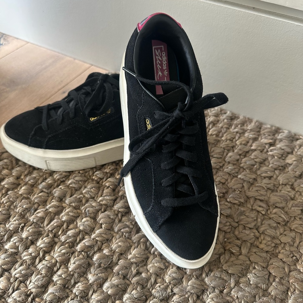 Cool Adidas Black Sneakers with White Soles.
